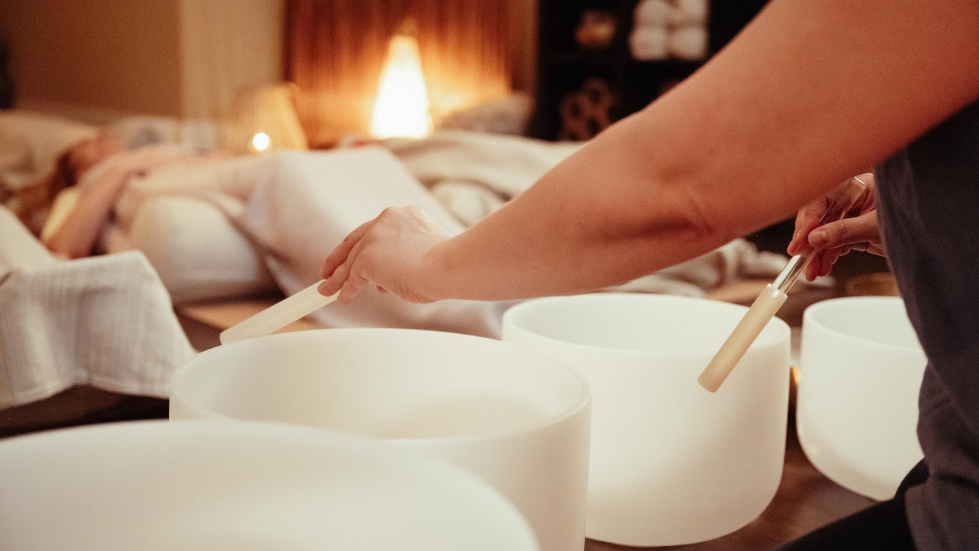 Sensory Sound Experience participants lying in comfortable beds behind the sound of glass bowls