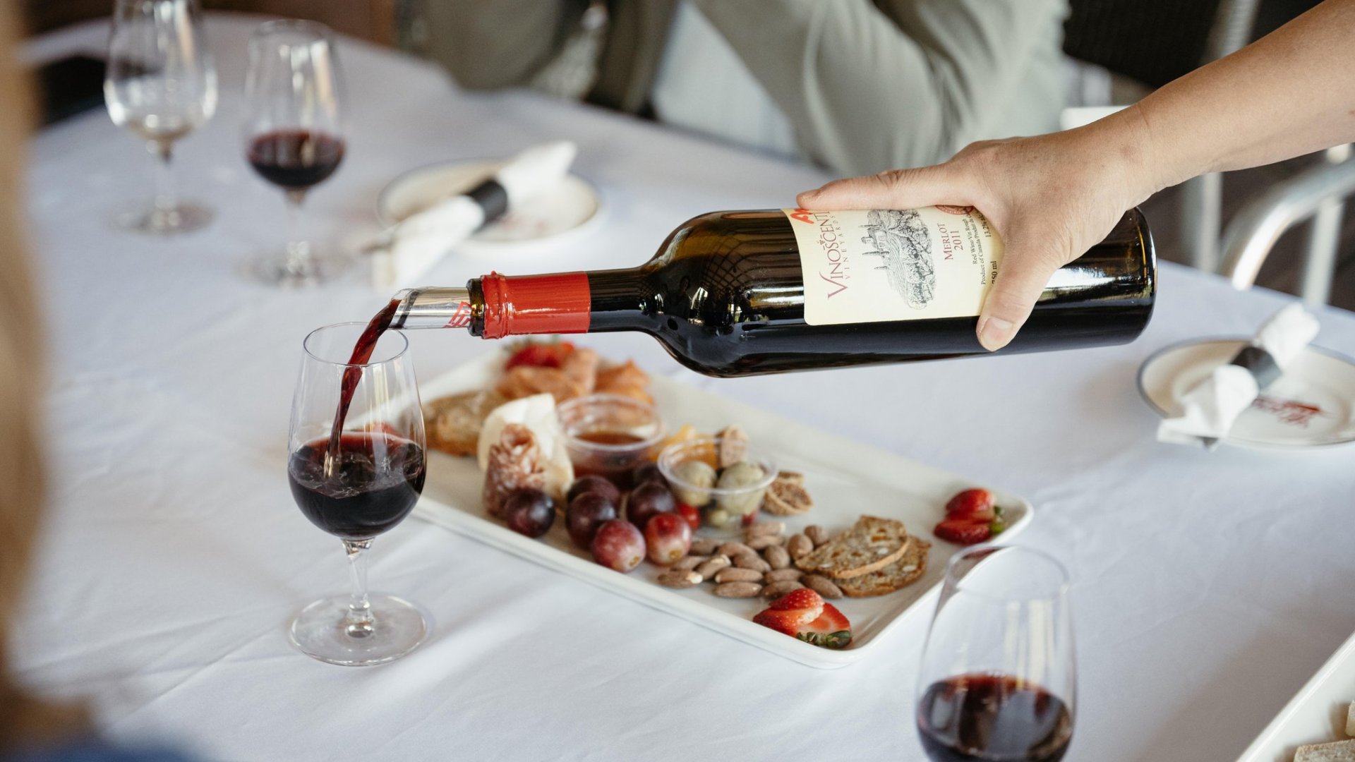 Vinoscenti Vineyard Lifestyle and Wine Tasting pouring a glass of wine as part of a vineyard tour